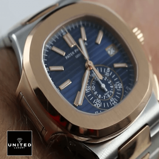 Patek Philippe Nautilus 5980/1AR-001 Patek Philippe Nautilus Blue Dial Gold Bezel Replica on the man wrist