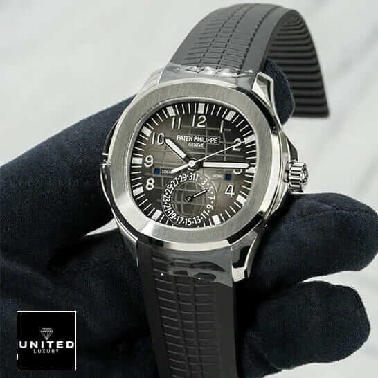 Patek Philippe Aquanaut Travel Time 5164A-001 Patek Philippe Black Dial Steel Bezel Replica on the black glove hand