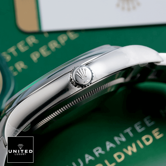 Rolex Datejust 114300 Oyster Perpetual Rolex Datejust Perpetual 114300 Stainless Steel Case & Crown Pusher Replica Right Side on the table