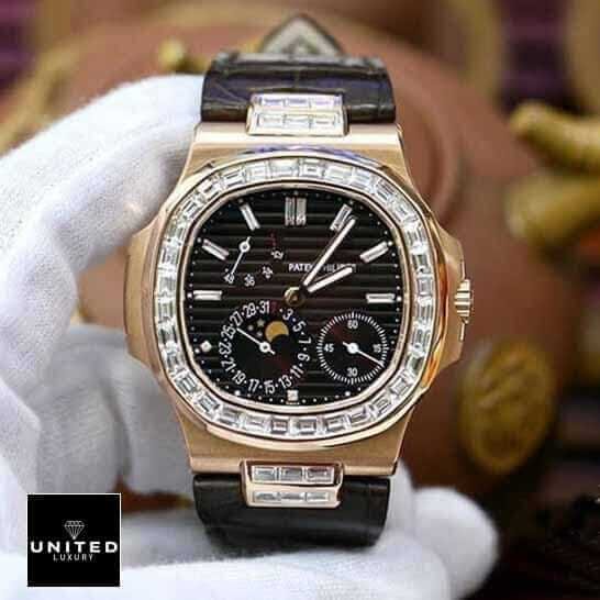 Patek Philippe Nautilus 5724 Patek Philippe Black Dial Diamond Bezel Leather Bracelet Replica on the hand
