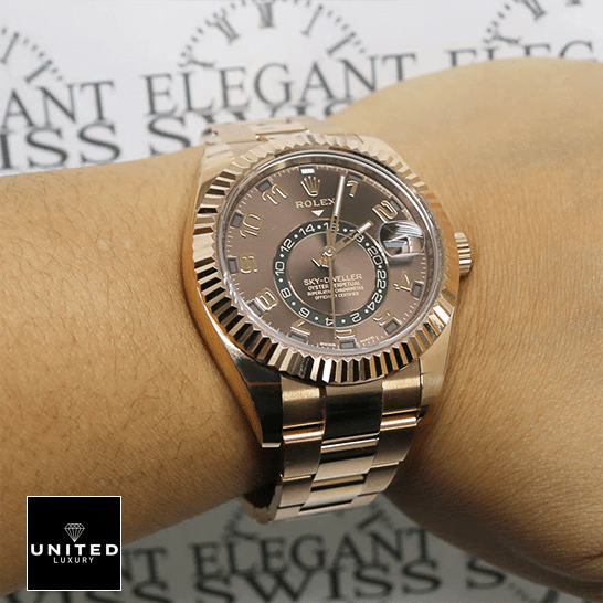 Rolex Sky-Dweller 326935 Rolex Sky-Dweller Chocolate Dial Rose Gold 326935-0003 Oyster Replica on his arm